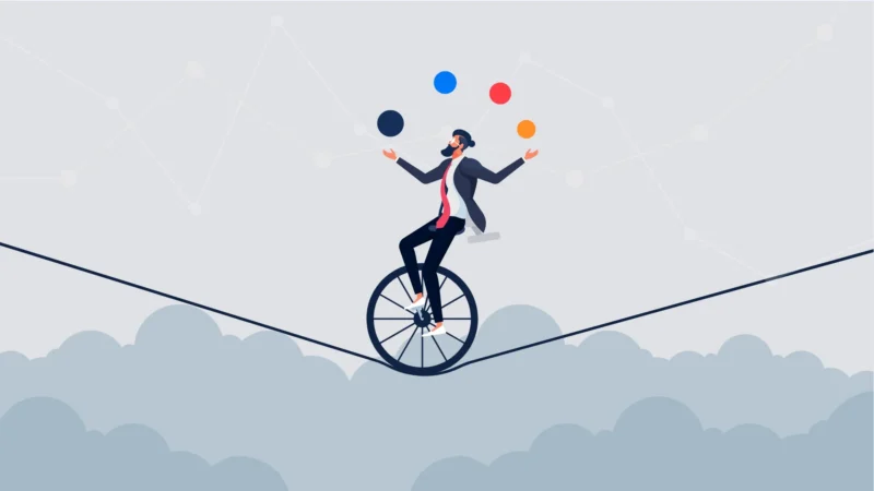 Man juggles balls while riding unicycle on tightrope